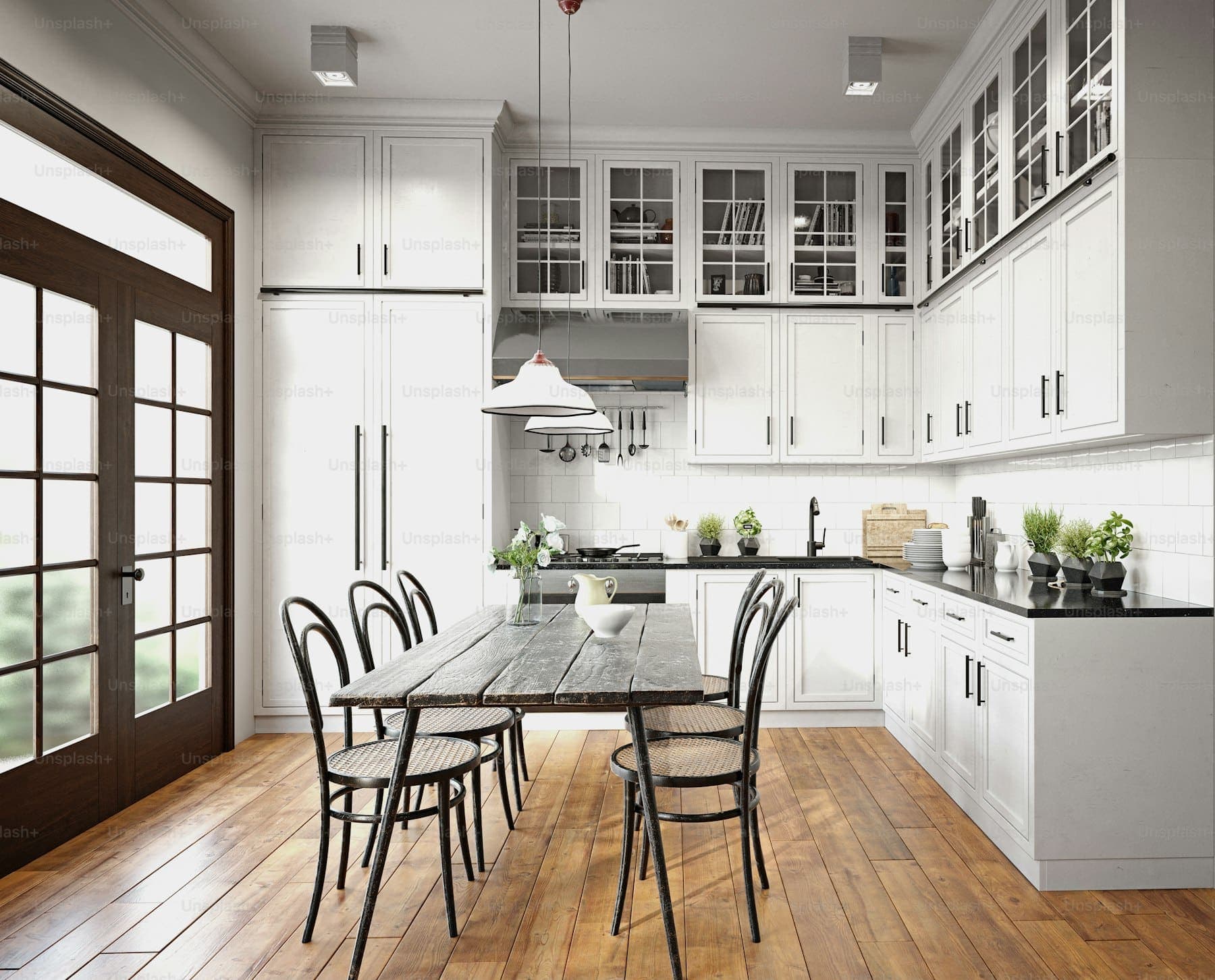Remodeled kitchen with white shaker cabinetry and a stone island